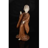 Property of a lady - a Japanese carved boxwood & ivory okimono depicting a bijin, loss to ivory fan,