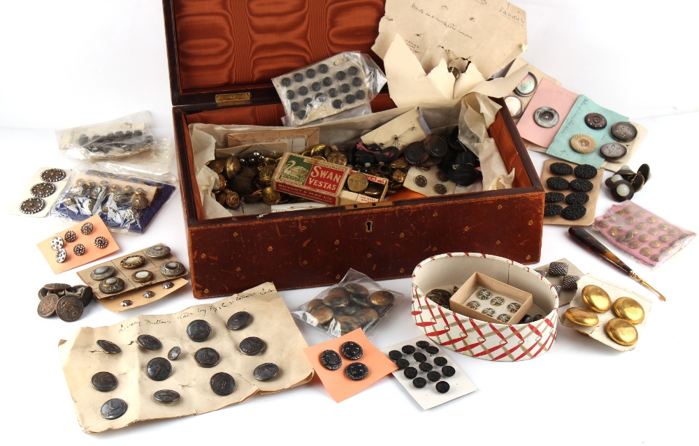 Property of a lady - a leather box containing assorted buttons including sets, the box 14.75ins. (