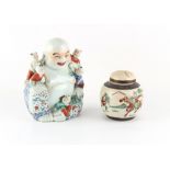 Property of a deceased estate - a Chinese famille rose figure of Budai, modelled seated with Boys,