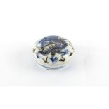 Property of a deceased estate - a Chinese blue & white & copper red circular seal paste box & cover,