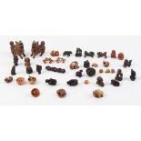 The Henry & Tricia Byrom Collection - a large collection of carved wood netsukes and small okimonos,