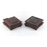 Property of a gentleman - a pair of late 19th century Chinese carved hardwood square stands, one