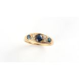 Property of a gentleman - an 18ct yellow gold sapphire & diamond ring, with three round cut