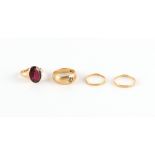 Property of a lady - four assorted gold rings comprising an 18ct yellow gold gipsy ring set with a