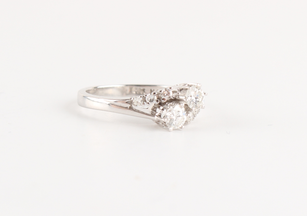 A 14ct white gold diamond crossover ring, with diamond shoulders, the two larger round brilliant cut - Image 2 of 2