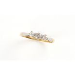 Property of a deceased estate - an 18ct yellow gold diamond three stone ring, approximately 0.25