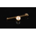 Property of a gentleman - a 22ct yellow gold bar brooch set with a single untested pearl, 33mm