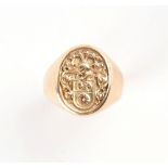A gentleman's unmarked yellow gold signet ring, size R, approximately 12.2 grams.