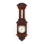 Property of a deceased estate - a late 19th / early 20th century carved walnut cased aneroid