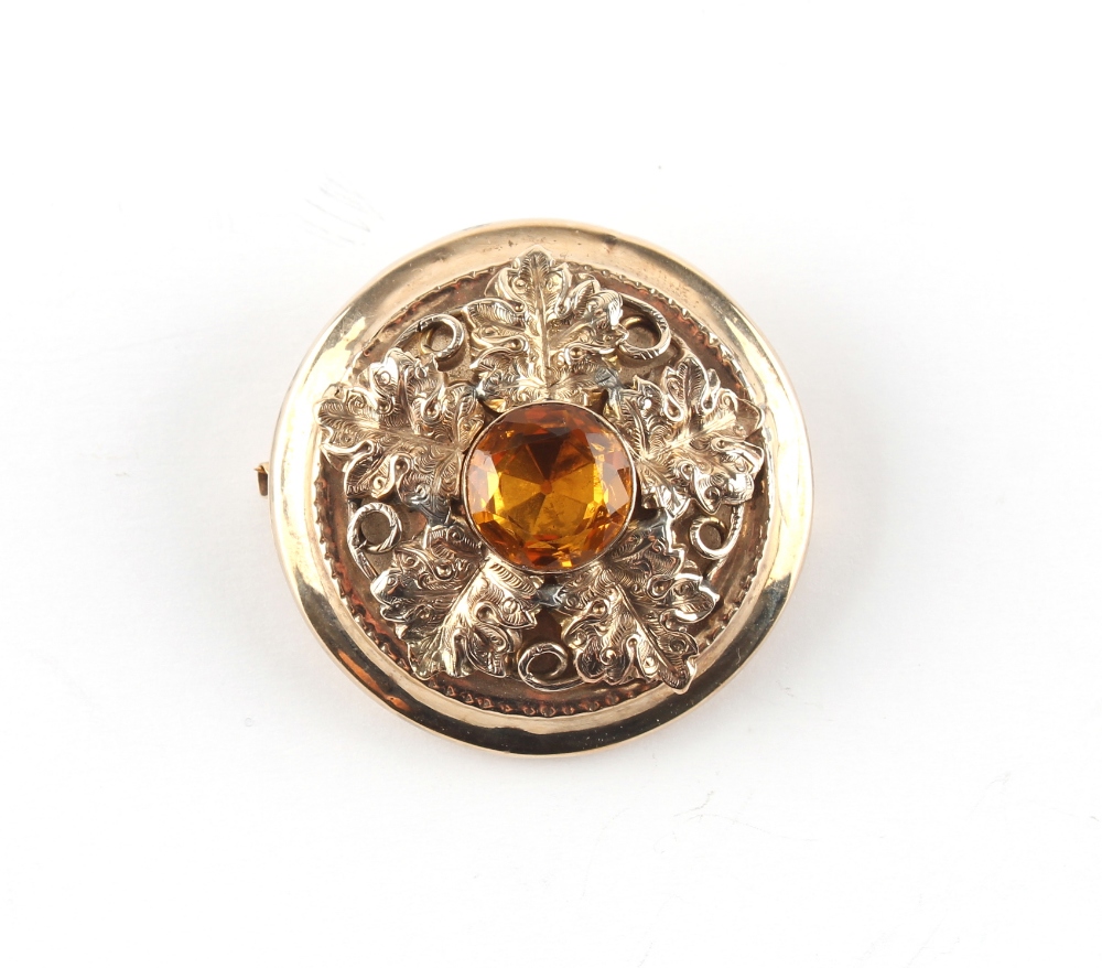 Property of a deceased estate - an unmarked yellow gold (tests 9ct) citrine mourning brooch, the