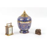 Property of a deceased estate - a brass carriage clock timepiece; together with a porcelain jar &