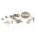 Property of a deceased estate - a bag containing assorted silver jewellery including a charm