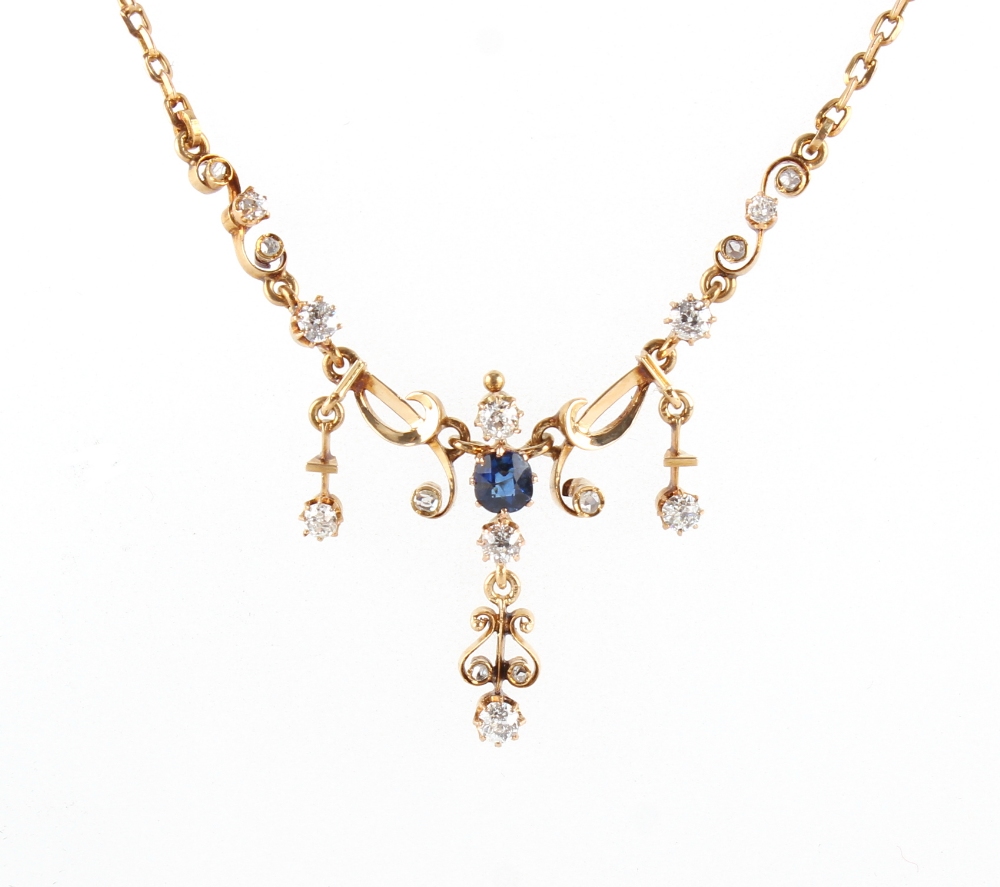An unmarked yellow gold sapphire & diamond necklace, with chain extension, 16.4ins. (41.5cms.) long.
