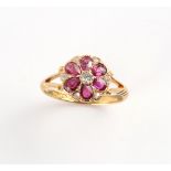 An Edwardian 18ct yellow gold ruby & diamond flowerhead cluster ring, Birmingham 1907, size L.