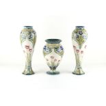 Property of a lady - William Moorcroft for James MacIntyre - a rare garniture of three Solifleur