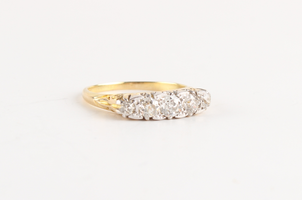 An 18ct yellow gold diamond five stone ring, the estimated total diamond weight 0.77 carat, size N/