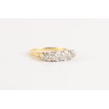 An 18ct yellow gold diamond five stone ring, the estimated total diamond weight 0.77 carat, size N/