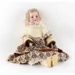 Property of a gentleman - an Armand Marseille bisque headed doll with sleeping eyes and open