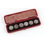 Property of a lady - a set of six Edwardian silver buttons, each decorated with a classical maiden