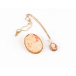 Property of a deceased estate - a 9ct gold mounted shell cameo brooch, 49mm long; together with a