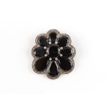 A large unusual diamond & black onyx floriform pendant brooch, 57mm long (excluding suspension