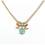 A 9ct gold turquoise & seed pearl bow & ball necklace, 15ins. (38cms.) long.