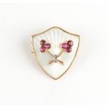 A late 19th / early 20th century Russian ruby diamond & guilloche enamel shield shaped brooch,