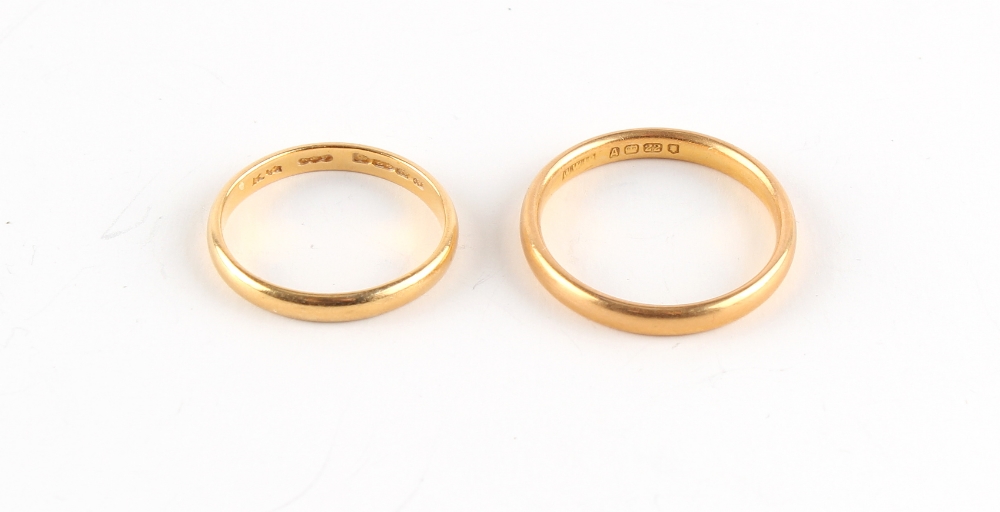 Property of a lady - two plain 22ct gold wedding bands or wedding rings, sizes Q and M,