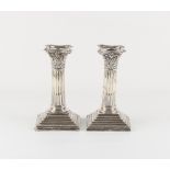 Property of a lady - a pair of late Victorian silver Corinthian column candlesticks, Harrison