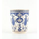 A Turkish Ottoman Iznik pottery vase, with blue painted stylised foliate decoration, 6.7ins. (