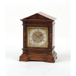 Property of a gentleman - a late 19th / early 20th century walnut cased mantel clock, with twin