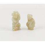 Two Chinese pale celadon jade carvings of Boys, 19th / early 20th century, chip to one foot, the