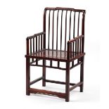 A Chinese hongmu armchair, with spindle back & arm supports.