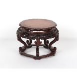 A Chinese hongmu & burr wood stand, well carved with lingzhi, 11.8ins. (30cms.) diameter (overall).