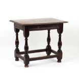 Property of a deceased estate - an oak rectangular topped centre table with carved edge & frieze, on