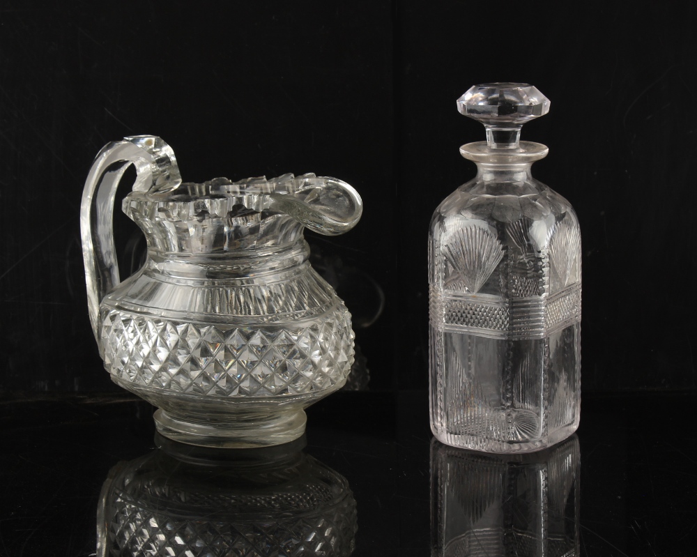 Property of a deceased estate - a 19th century heavy cut glass water jug, two rim castellations