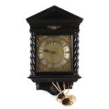 The Henry & Tricia Byrom Collection - an ebonised cased 30-hour wall clock, with 10-inch square