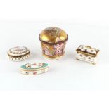 Property of a lady - a group of four late 19th and early 20th century porcelain trinket boxes, the