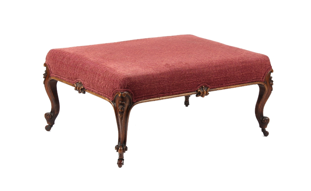 Property of a lady - a large Victorian walnut & later red upholstered lounge stool, with carved