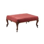Property of a lady - a large Victorian walnut & later red upholstered lounge stool, with carved