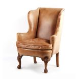 Property of a gentleman - an early 20th century George II style walnut & tan leather upholstered