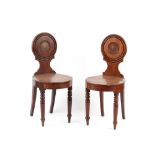 Property of a deceased estate - a pair of early 19th century Regency period hall chairs, each with