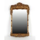 Property of a deceased estate - a 19th century George II style gilt framed wall mirror, 28.8ins. (