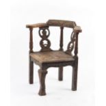 Property of a lady - a late Victorian carved oak corner chair.