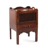 Property of a deceased estate - a George III mahogany tray-top tambour fronted commode, the base not