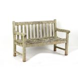 Property of a gentleman - a small well weathered teak garden bench, 47.5ins. (120.5cms.) long.