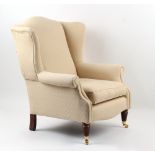 Property of a gentleman - a Victorian style upholstered wing armchair, with turned & fluted front