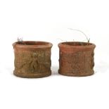 Property of a gentleman - a pair of weathered terracotta garden planters with cherub decorations,