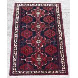 Property of a lady - a Persian Shahsavan hand knotted wool rug, with navy field, 79 by 51ins. (201