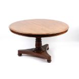Property of a gentleman - an early 19th century William IV rosewood circular tilt-top dining